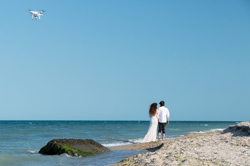 Hovering Drone Taking Pictures of Wedding Couple